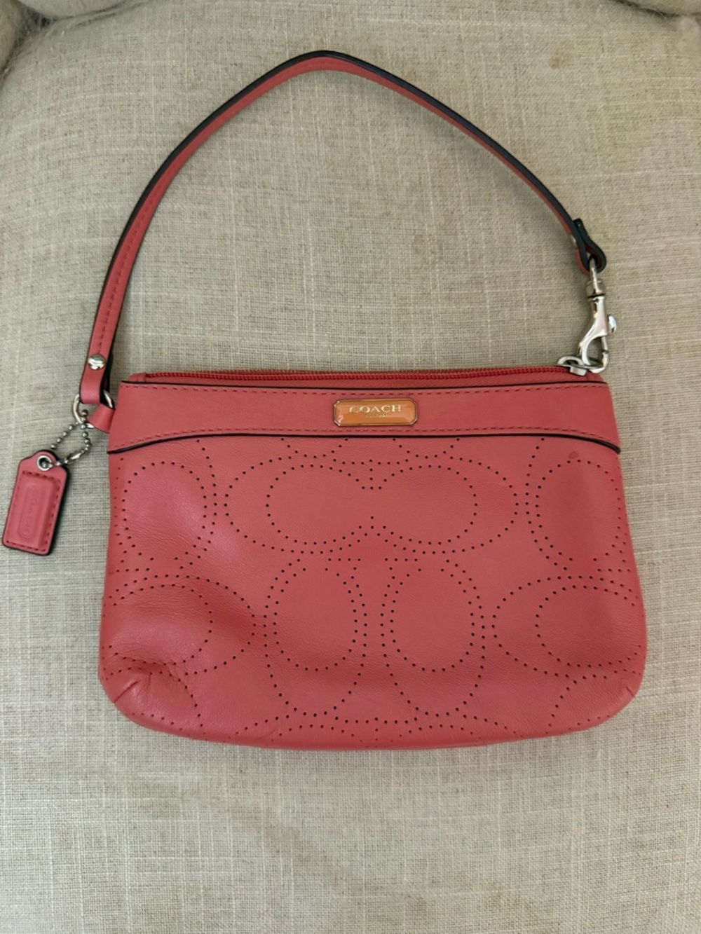 Coach Coral Pink Perforated Leather Wristlet